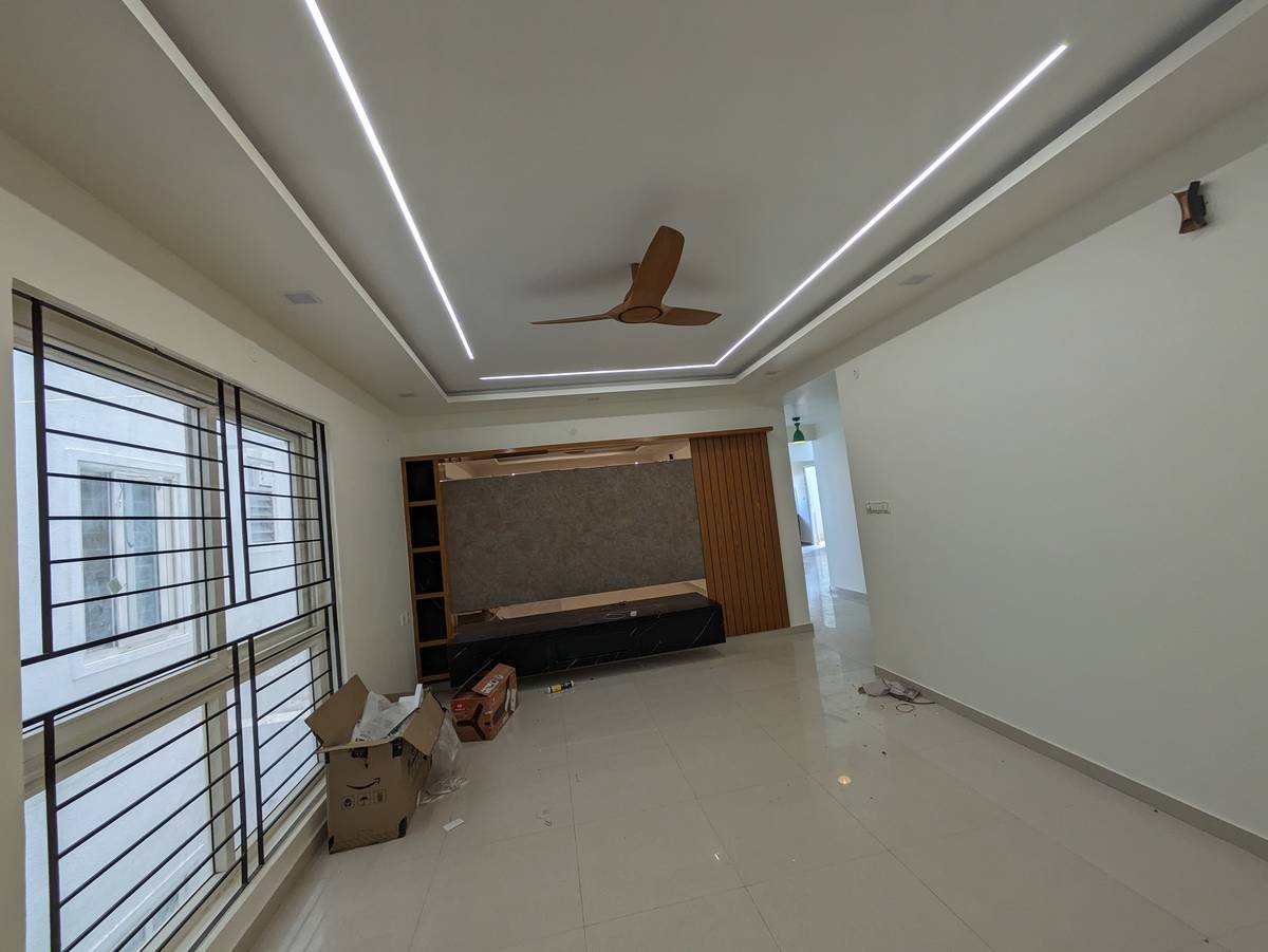 Living room with premium TV unit and false ceiling